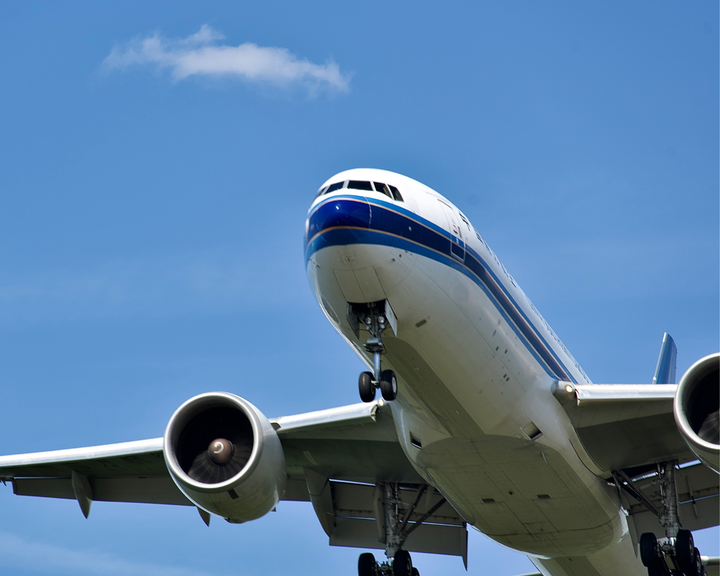 A large plane with a blue stripe