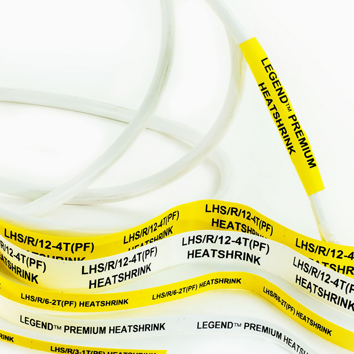 Yellow and white heatshrink tubing labels with black text, including “LEGEND™ PREMIUM HEATSHRINK” and codes like “LHS/R/12-4T(PF)